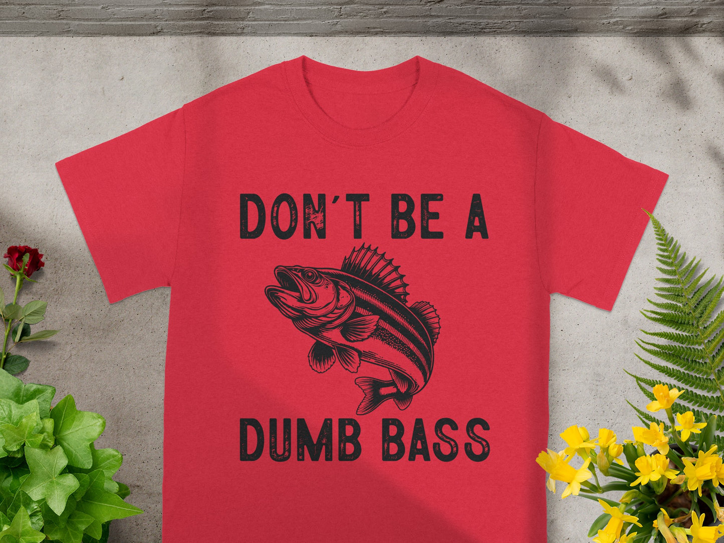 Red t-shirt with "DON'T BE A DUMB BASS" and a fish graphic.