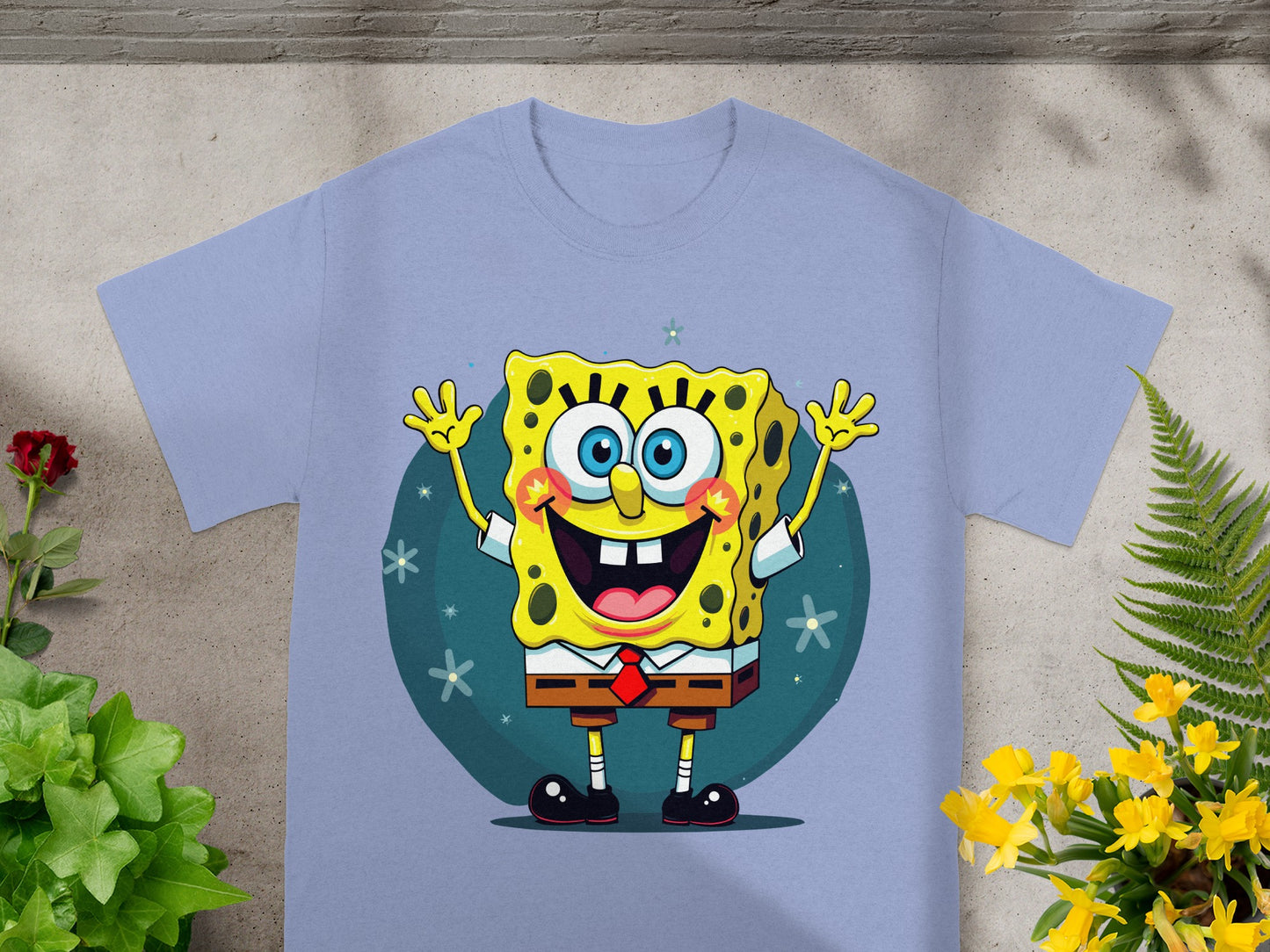 SpongeBob SquarePants on a light purple t-shirt with a blue background.
