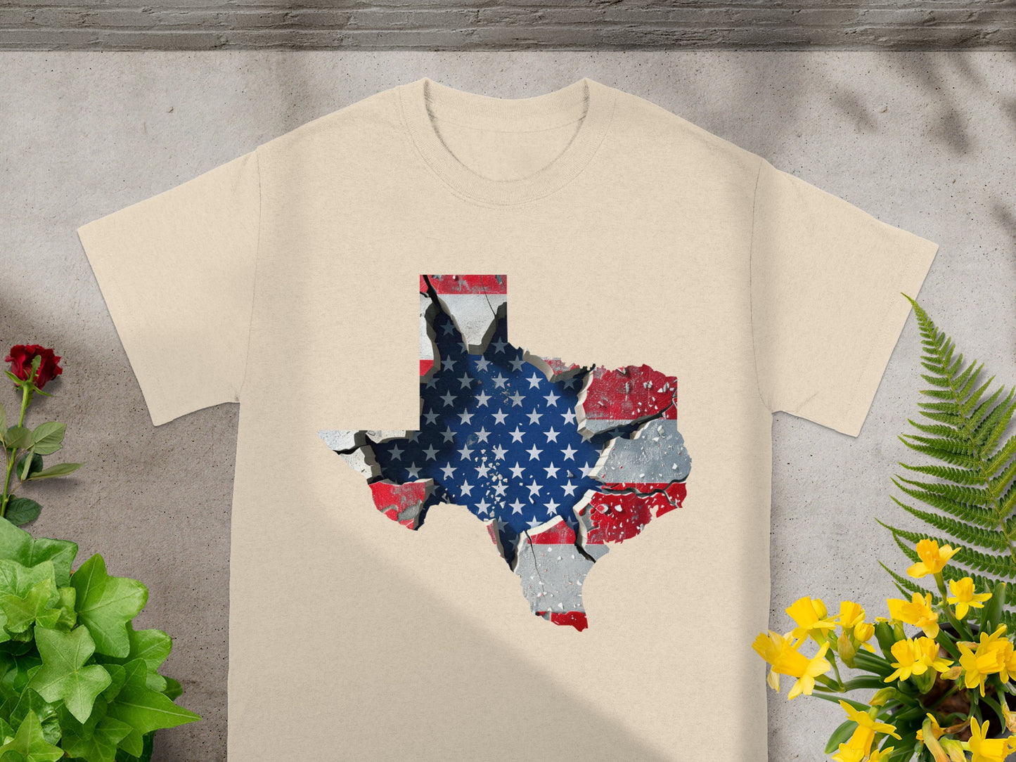 Cream t-shirt with cracked Texas map graphic overlaid with American flag.