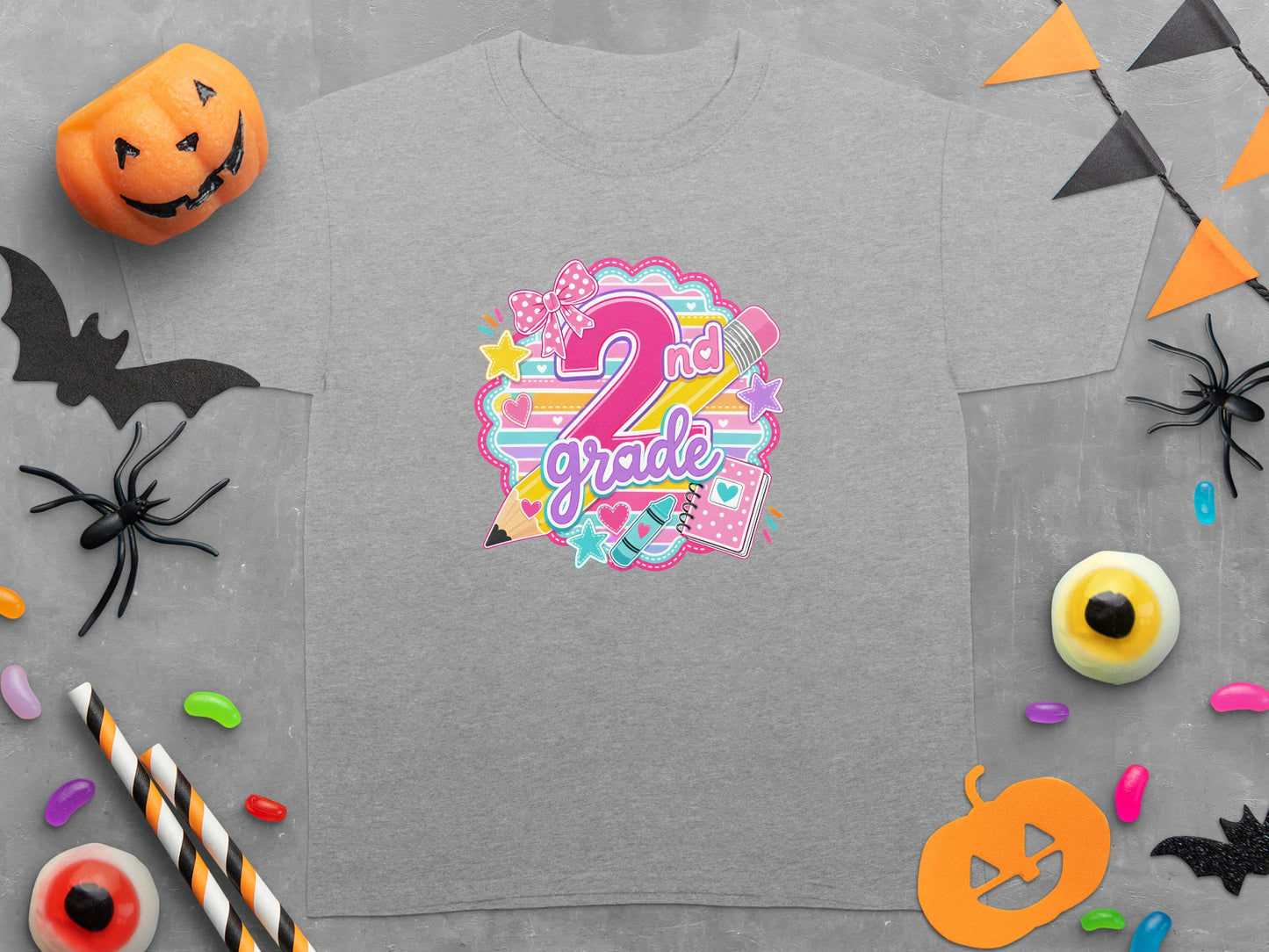 2nd grade graphic on a grey t-shirt with Halloween decorations.