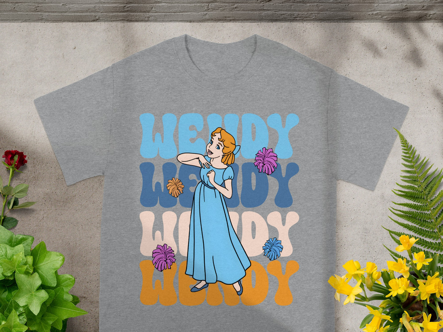 Wendy with colorful text and floral accents.