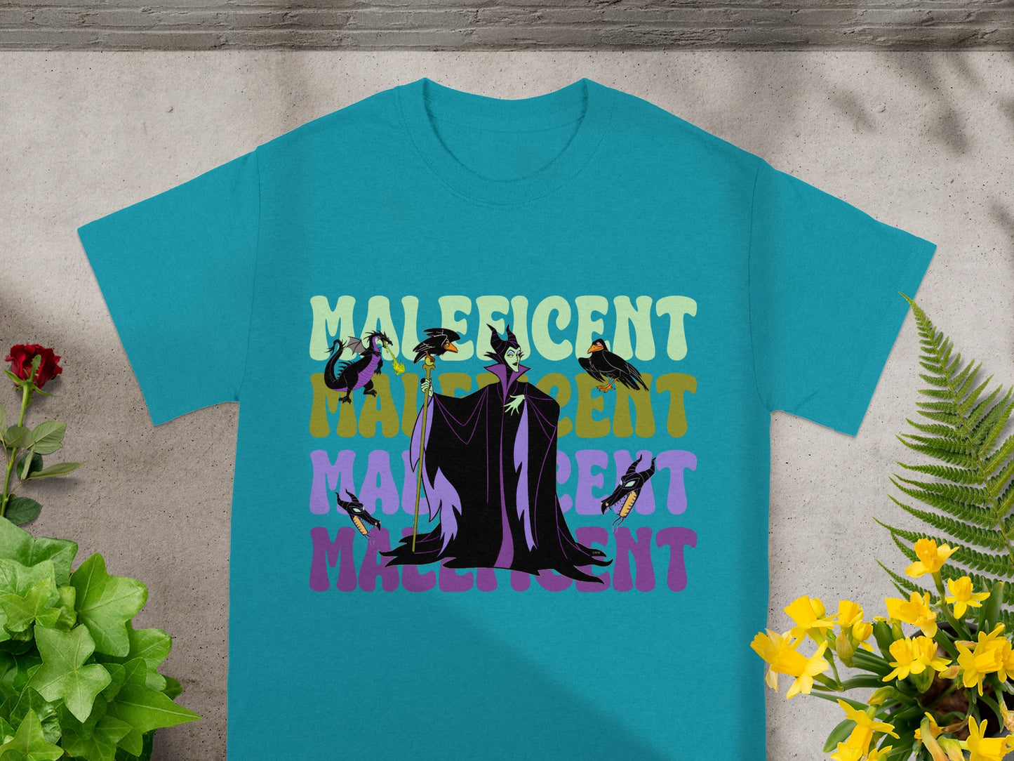 Turquoise t-shirt with Maleficent graphic and text.