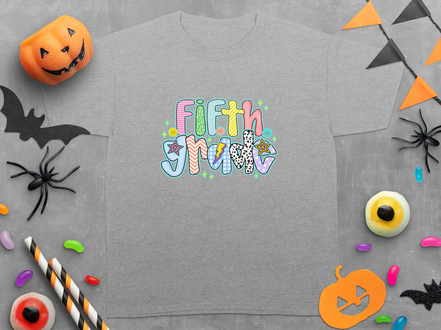 Grey t-shirt with "Fifth Grade" text in a colorful, playful font.