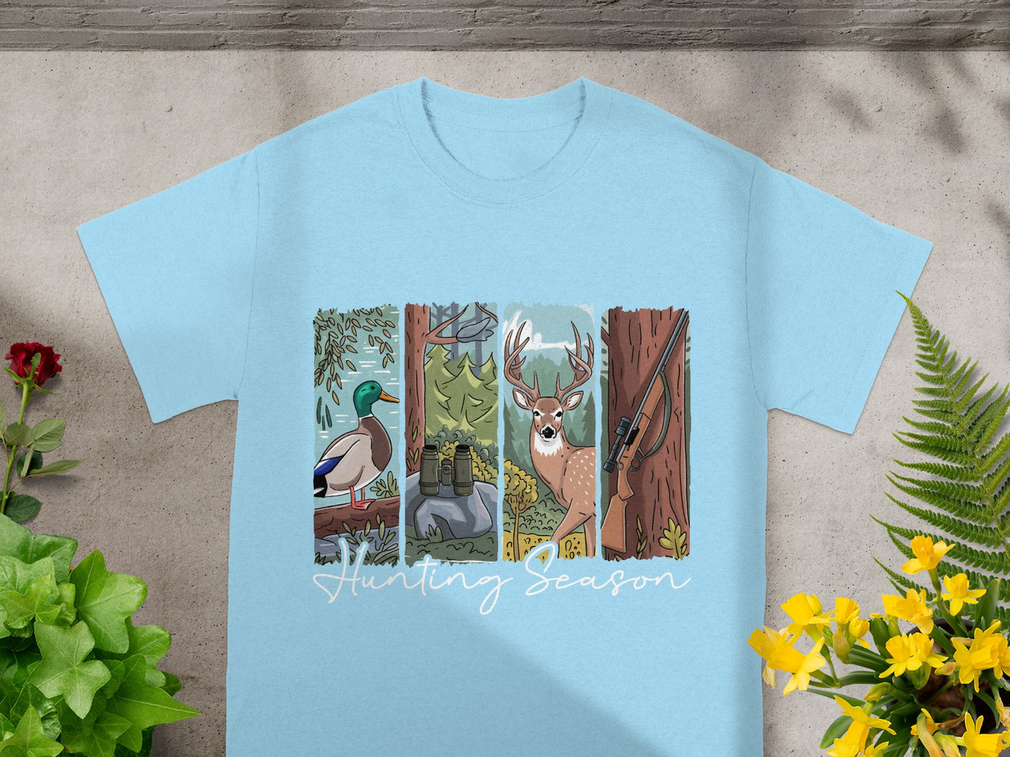 Light blue t-shirt with a four-panel hunting graphic and "Hunting Season" text.