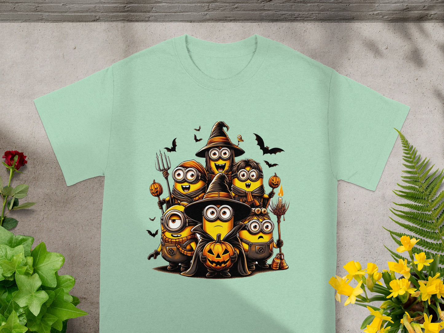 Minions dressed in Halloween costumes, holding pumpkins and a broomstick.