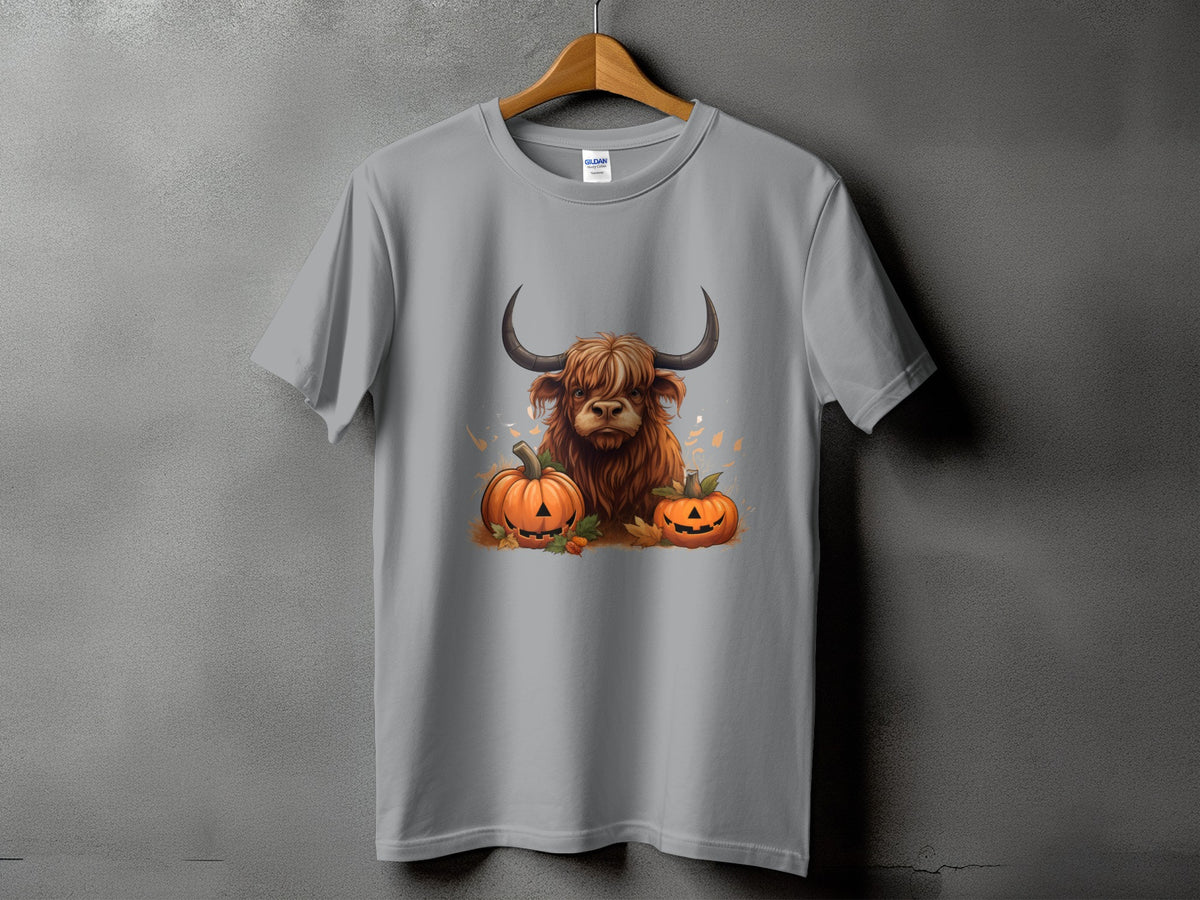 Scottish Highland cow with pumpkins and fall leaves graphic on a grey t-shirt.