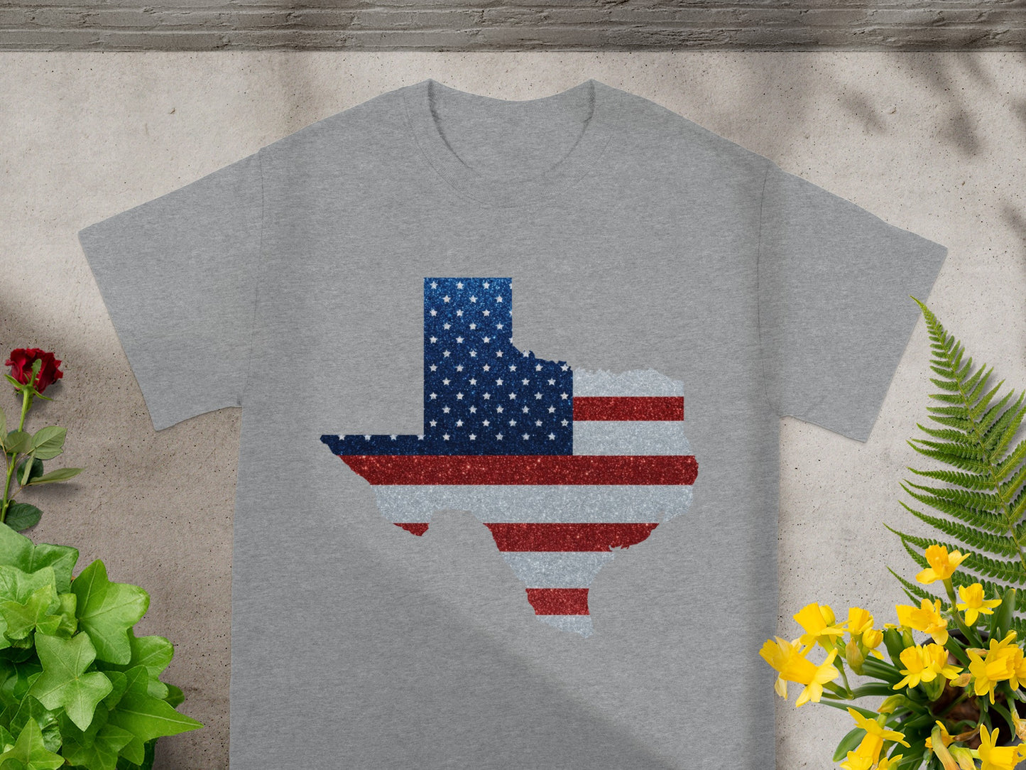 Grey t-shirt with Texas map design featuring American flag pattern.