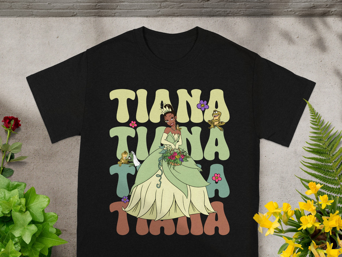 Black t-shirt with Tiana's name and Princess Tiana in a green gown.