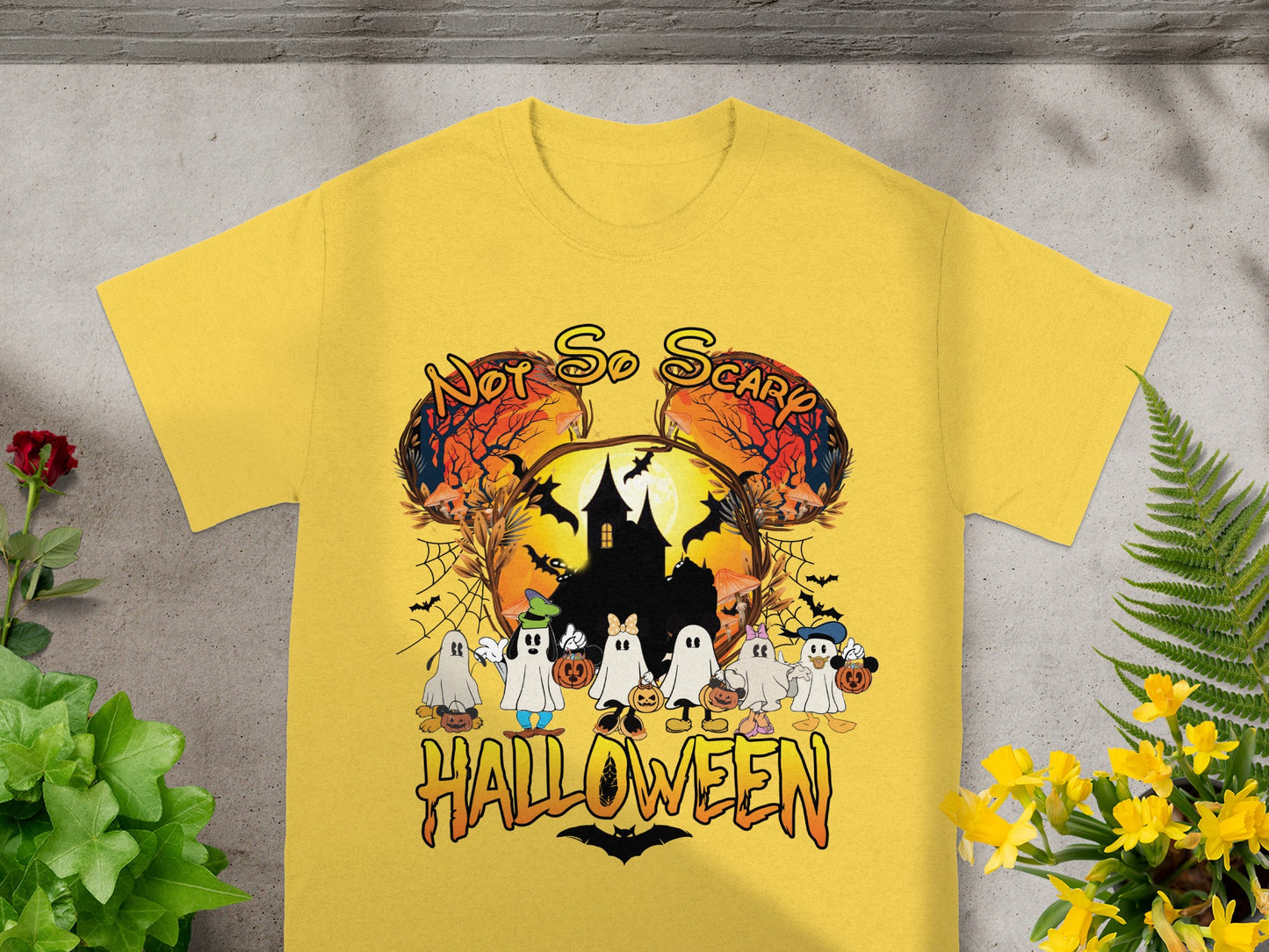 Yellow t-shirt with "Not So Scary Halloween" graphic featuring ghosts and a haunted house.