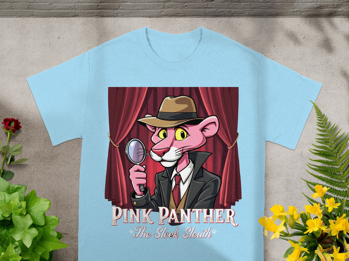 Light blue t-shirt with cartoon Pink Panther detective holding magnifying glass.