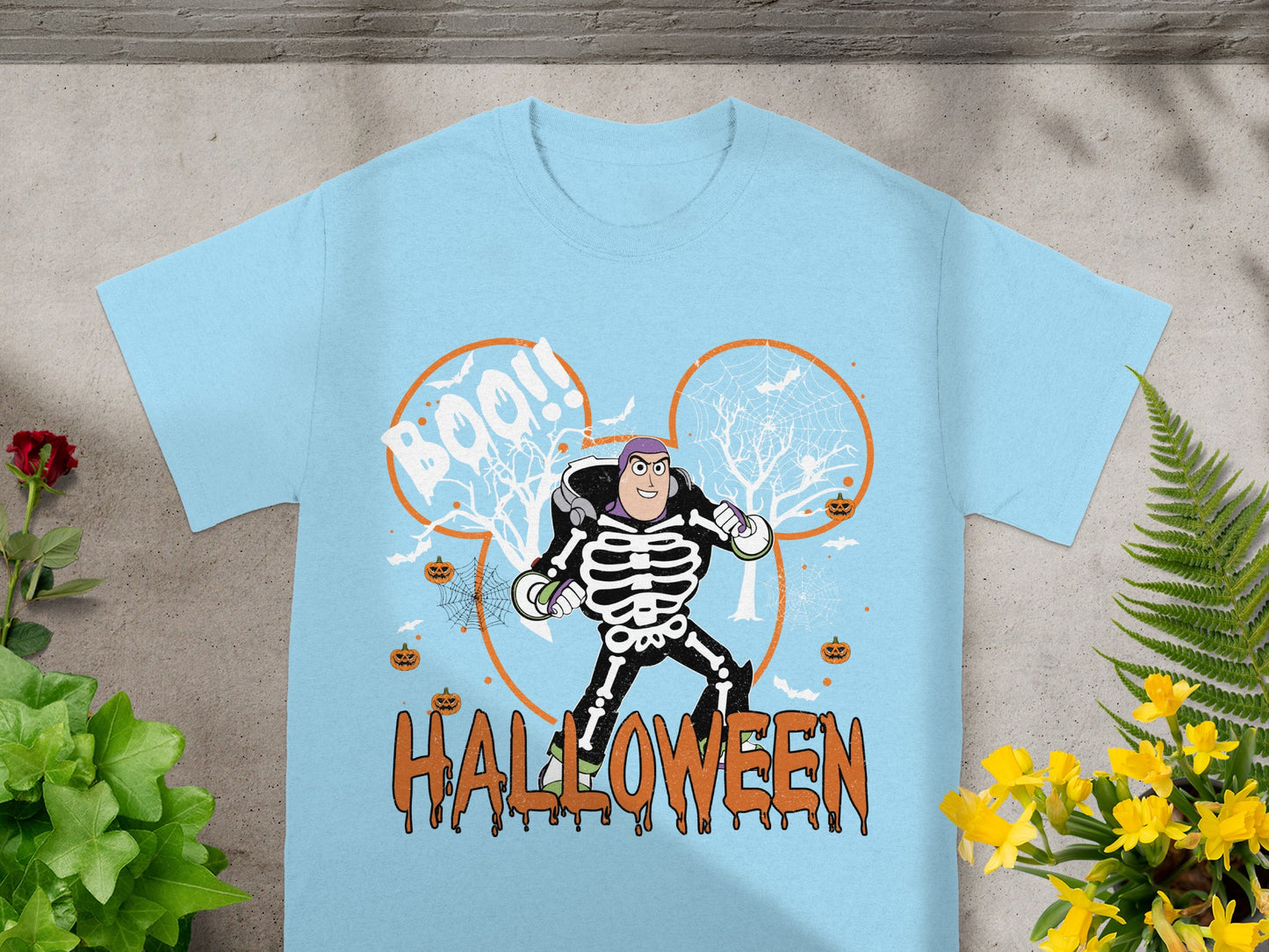 Light blue t-shirt with Buzz Lightyear in a skeleton costume and "Halloween" text.