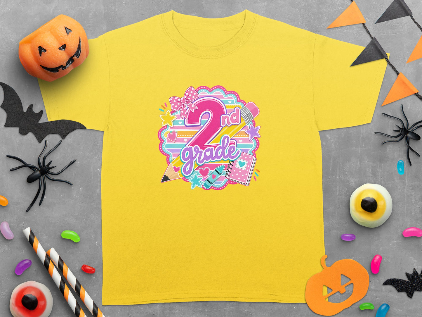 Yellow t-shirt with "2nd grade" text and school supplies graphic.