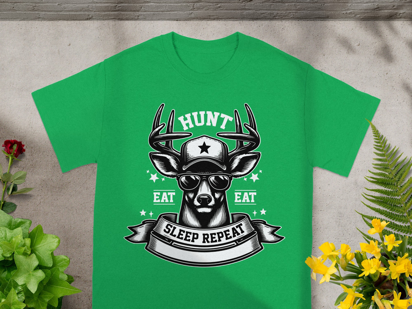 Green t-shirt with a deer wearing sunglasses and a hat, text reads "Hunt", "Eat", "Sleep Repeat".