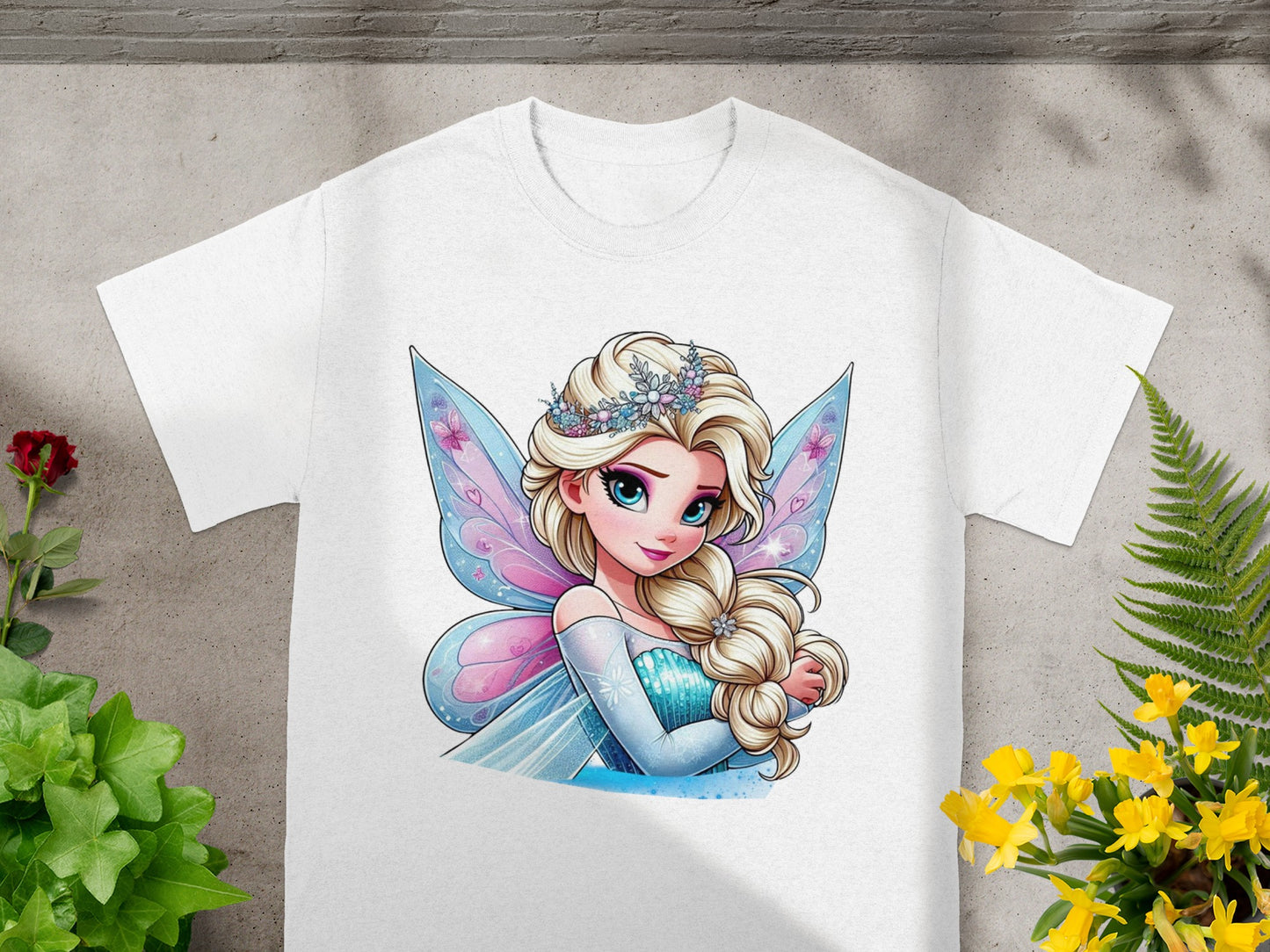 White t-shirt featuring a cartoon princess with blonde hair, blue eyes, and fairy wings.