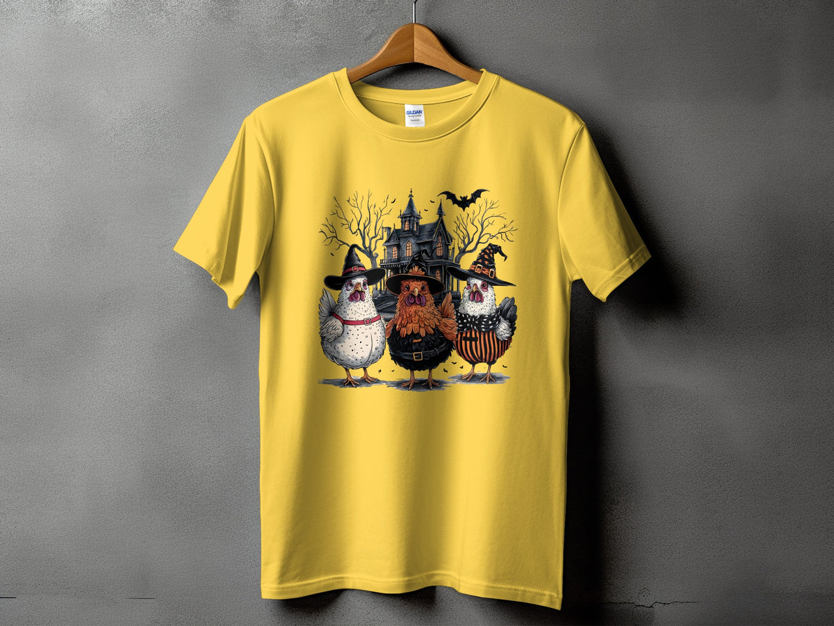 Yellow t-shirt with Halloween graphic of three chickens in costumes and a haunted house.