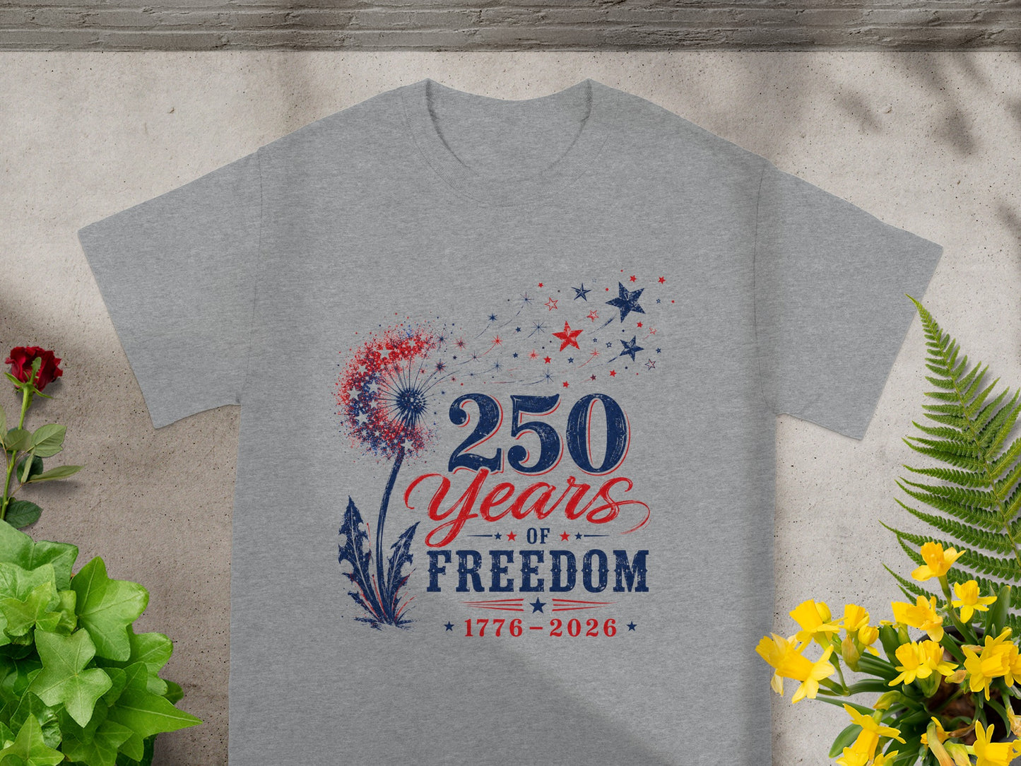 Grey t-shirt with "250 Years Of Freedom 1776-2026" and a dandelion design.