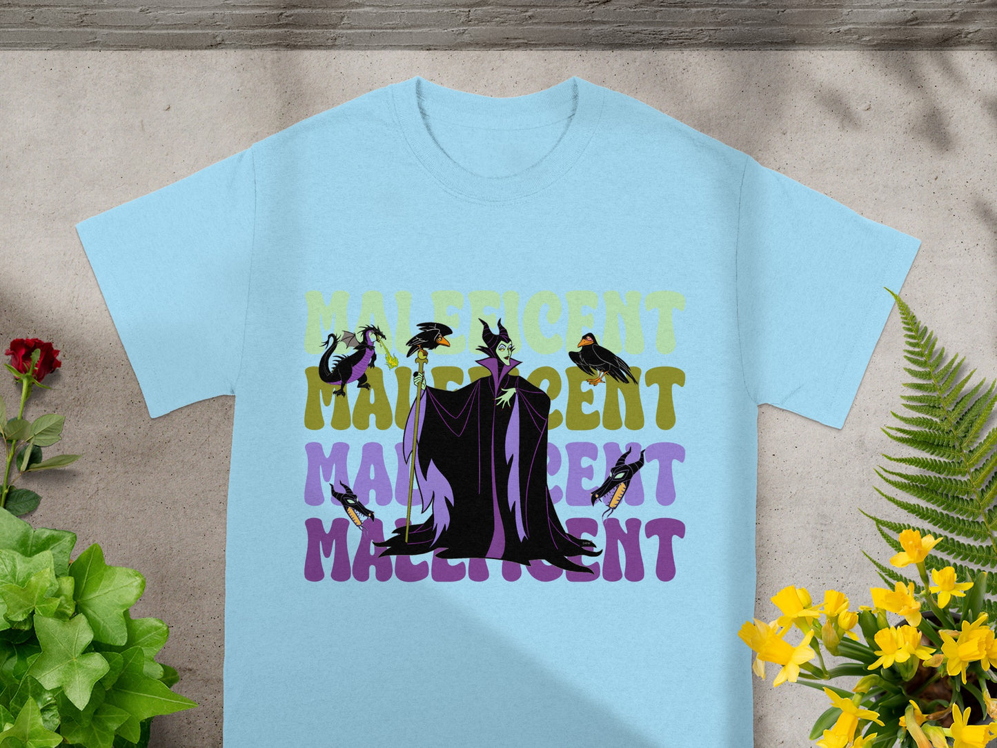 Light blue t-shirt with Maleficent graphic and text.