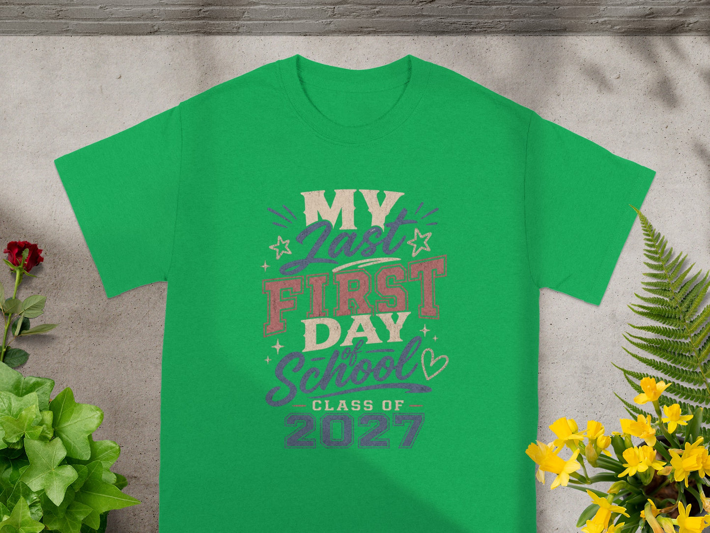 Green t-shirt with "My Last First Day School Class of 2027" graphic.