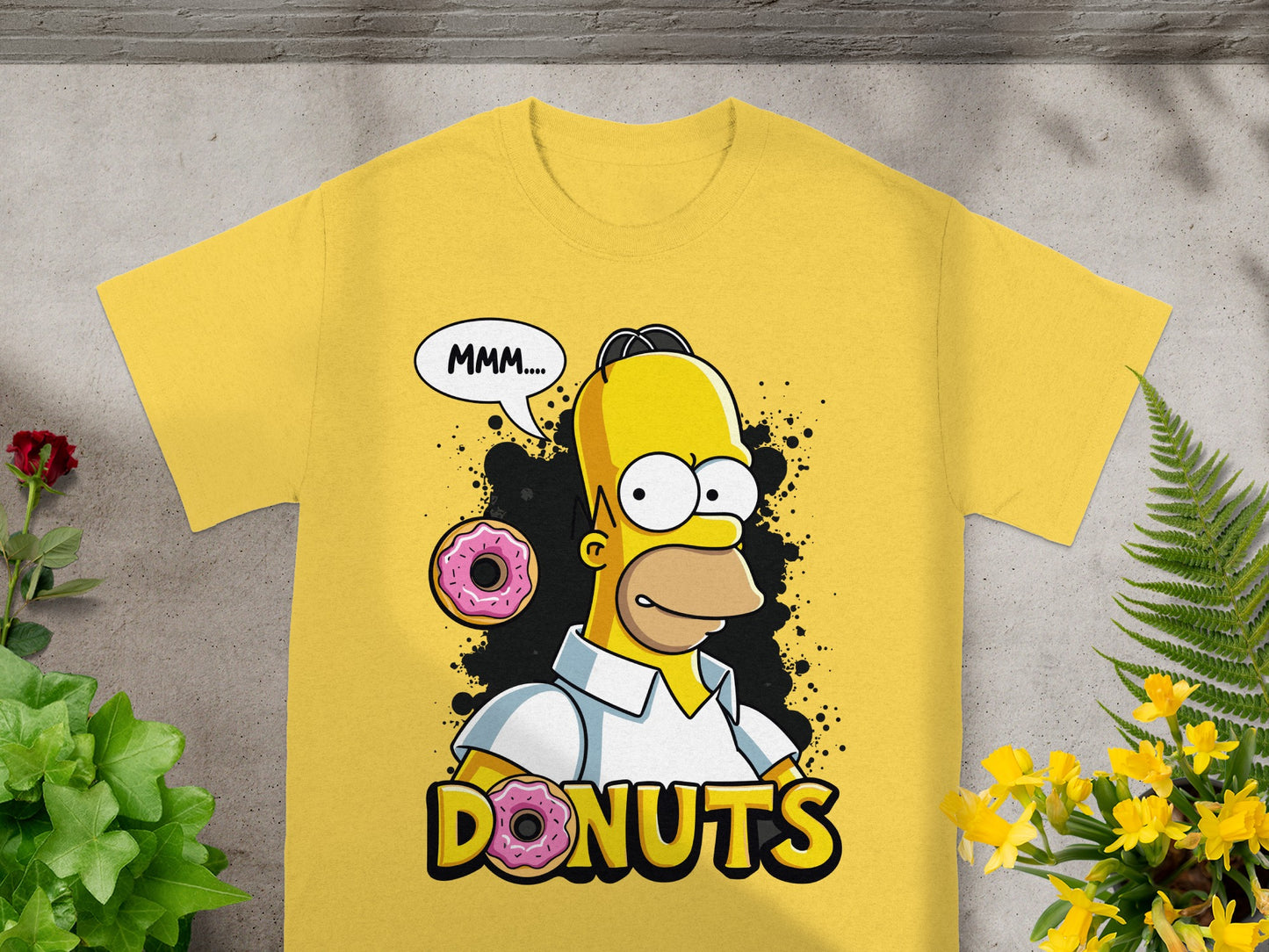 Homer Simpson with donuts, saying "MMM....DONUTS" on a yellow t-shirt.