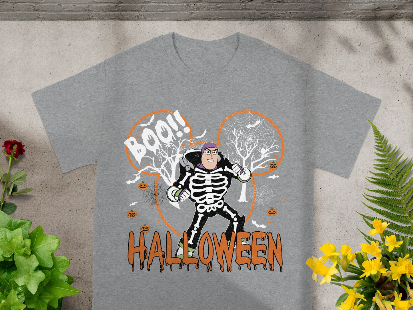 Buzz Lightyear skeleton graphic with Halloween theme on a gray t-shirt.