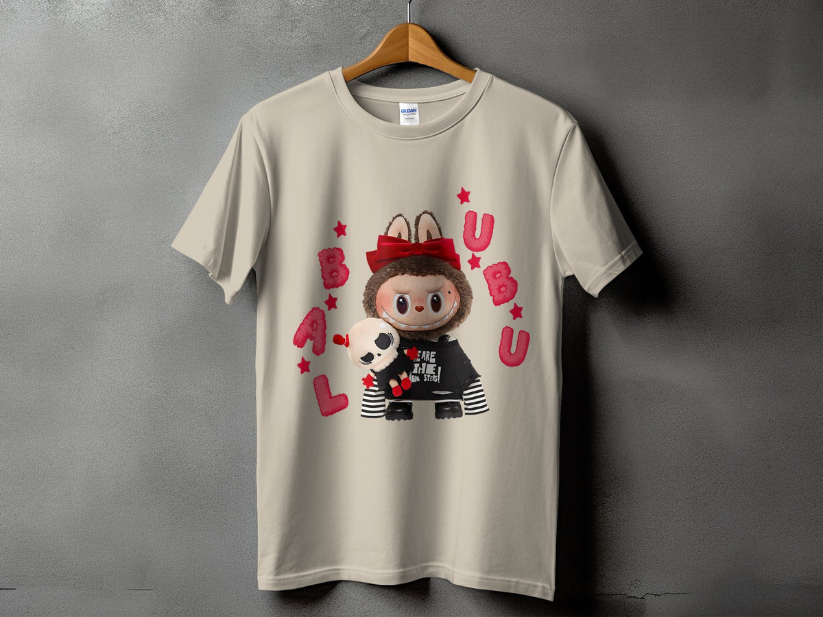 Tan t-shirt with a character wearing a black shirt with "BEARE THE MONSTERS!" text.