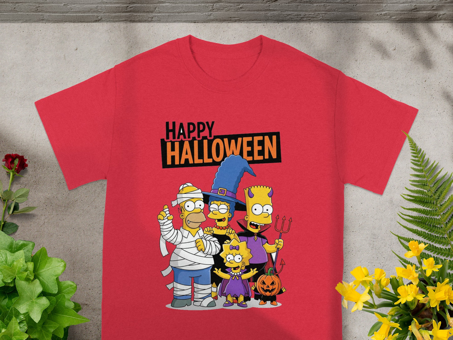Simpsons family in Halloween costumes with "Happy Halloween" text on a red shirt.
