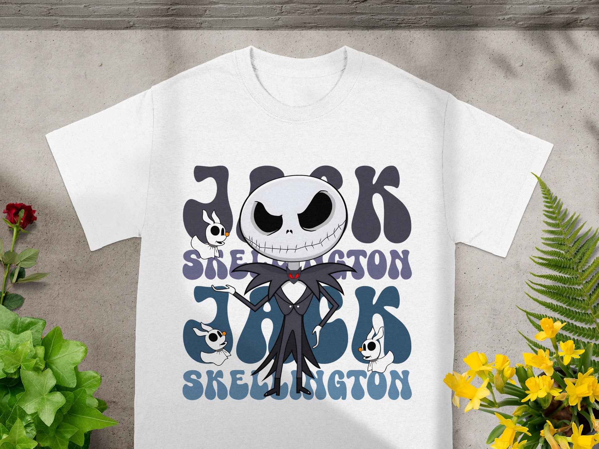 White t-shirt with Jack Skellington graphic and two small ghost-like characters.