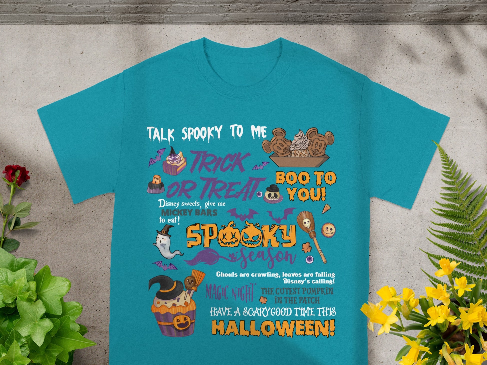 Teal t-shirt with "Talk Spooky to Me" Halloween graphic and Disney-themed text.