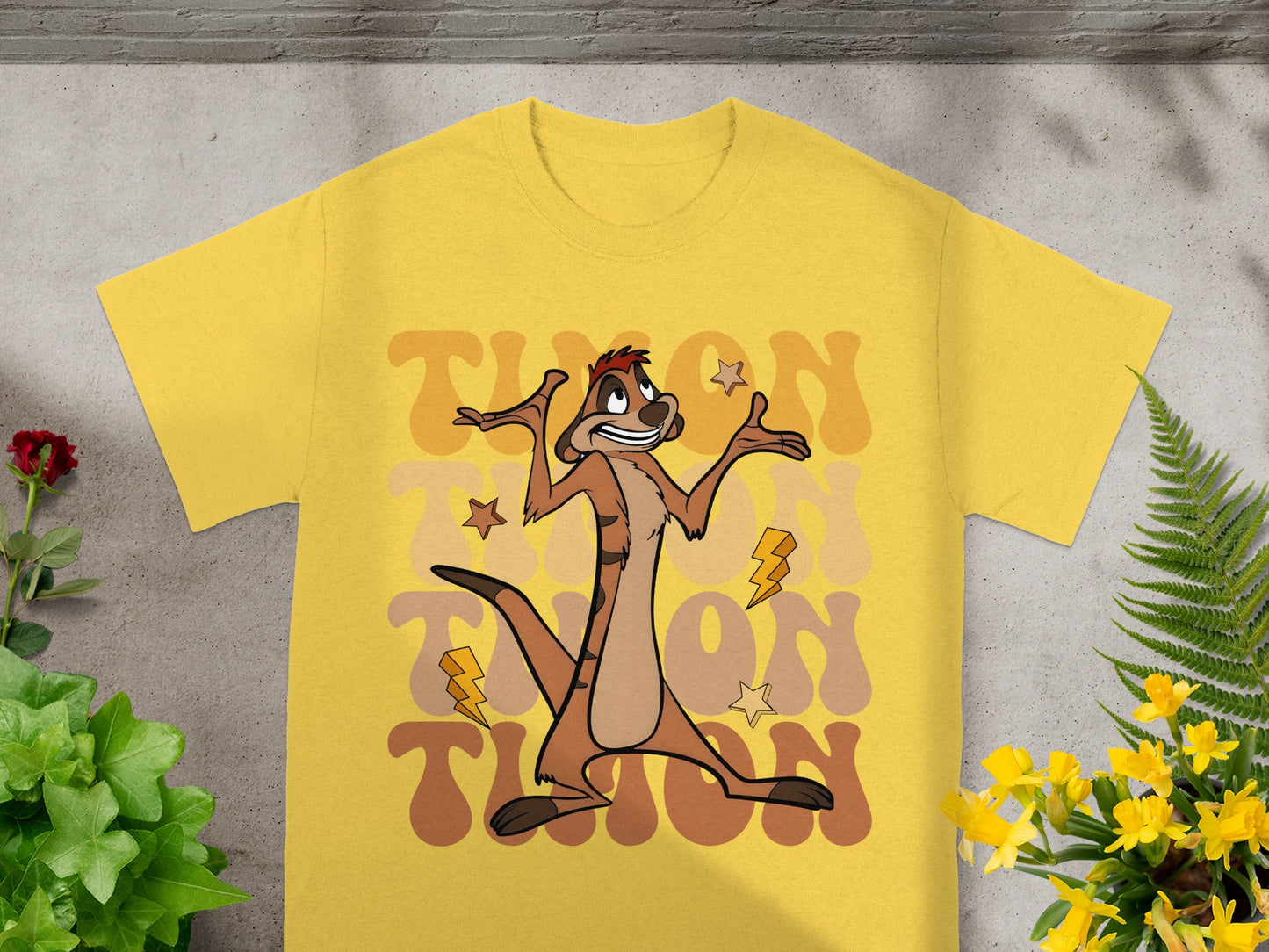 Yellow t-shirt with Timon from The Lion King and retro text.