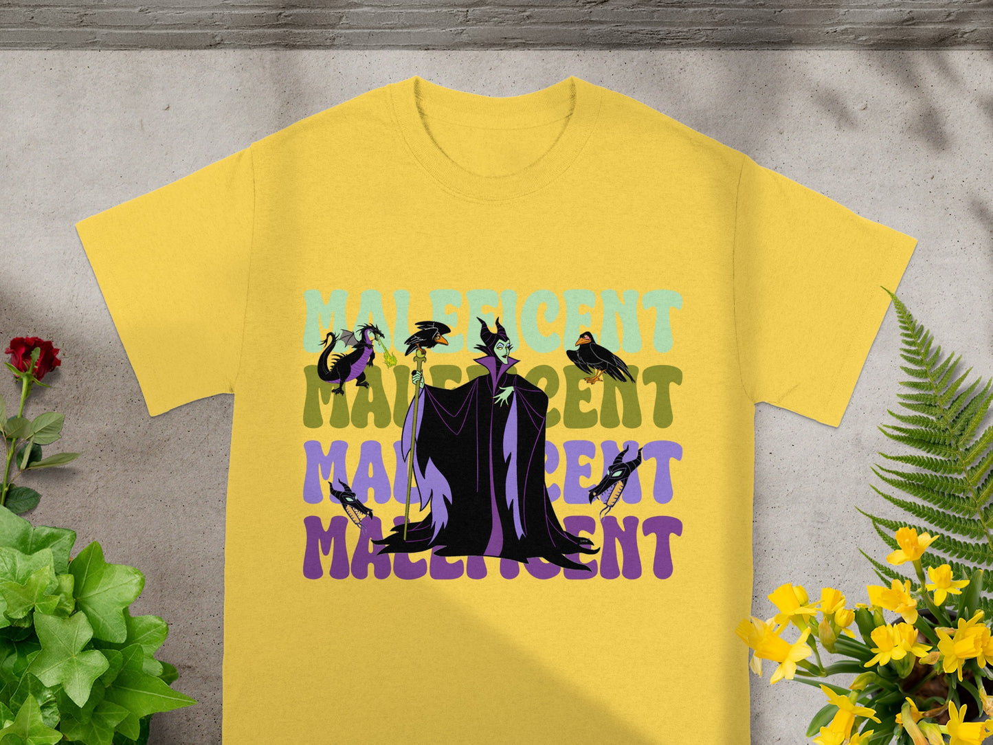 Maleficent graphic on yellow t-shirt with text "MALIFICENT".