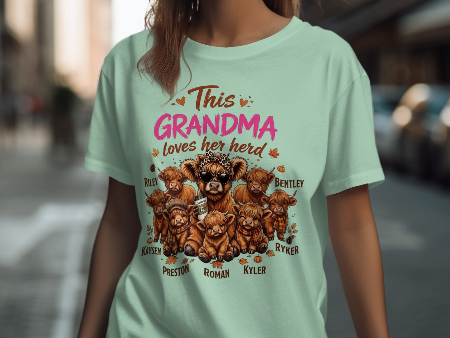 This Grandma loves her herd t-shirt features highland cattle with names: Riley, Kaysen, Preston, Roman, Kyler, Bentley, and Ryker.