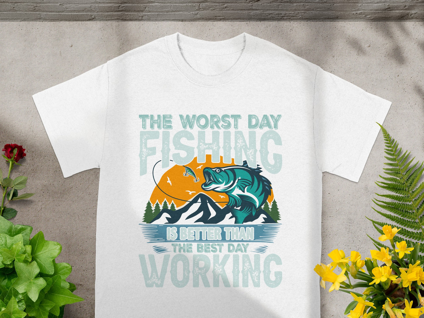 White t-shirt with fishing graphic and text: "The worst day fishing is better than the best day working."