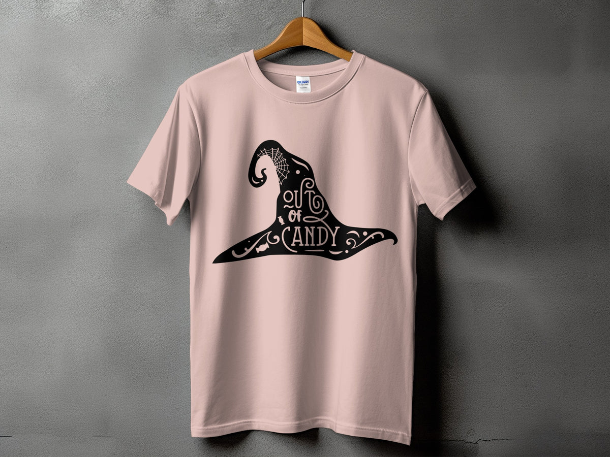 Pink t-shirt with black witch hat graphic that says "out of candy".
