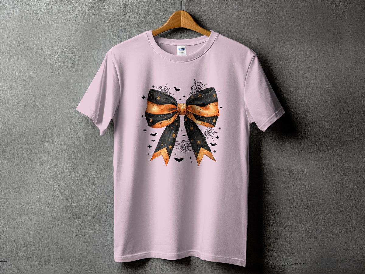 Pink t-shirt with a large black and orange Halloween bow graphic.