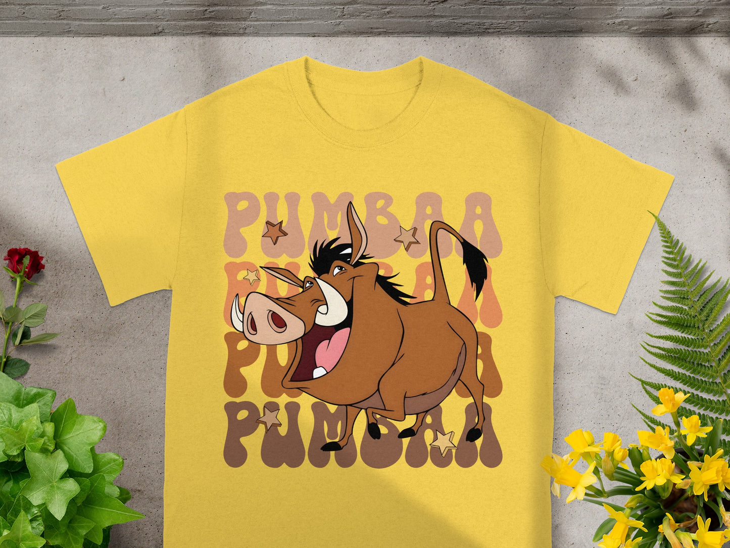 Yellow t-shirt featuring Pumbaa from The Lion King, with wavy text.