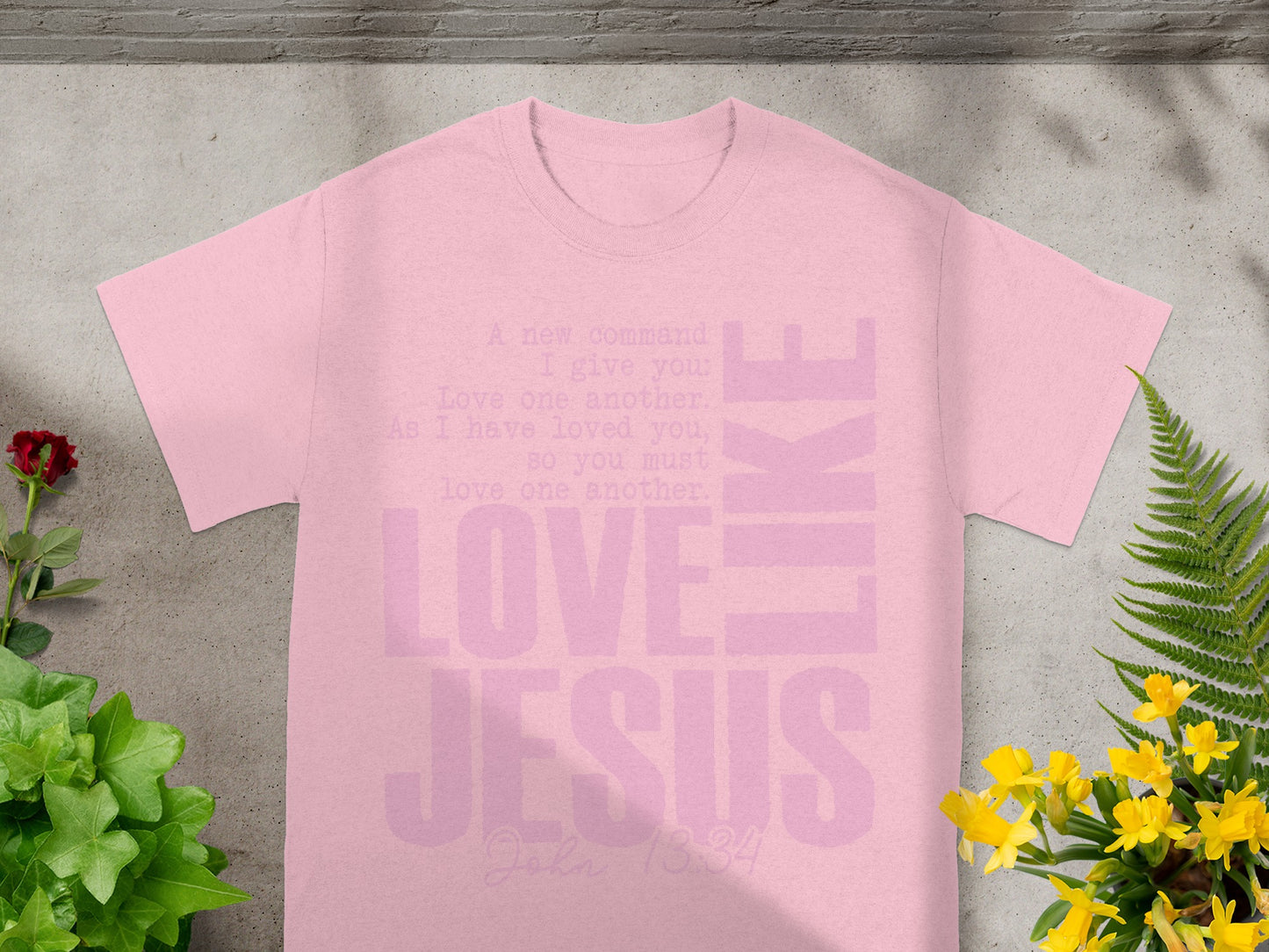 Pink t-shirt with "Love Jesus Like" and Bible verse John 13:34.