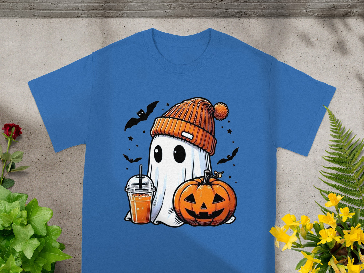 Ghost in orange beanie with drink and pumpkin, surrounded by bats and stars.