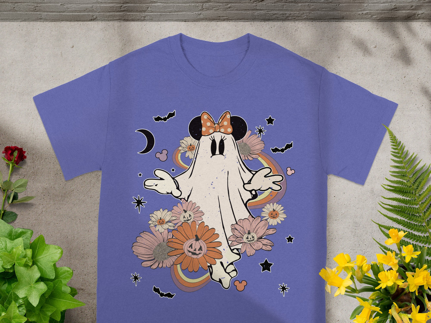 Purple t-shirt with Halloween ghost, flowers, bats, moon, and rainbows.