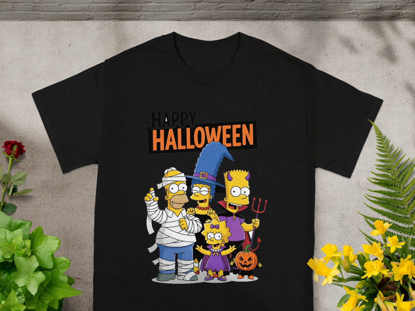 Black t-shirt with Simpsons characters dressed for Halloween and "Happy Halloween" text.