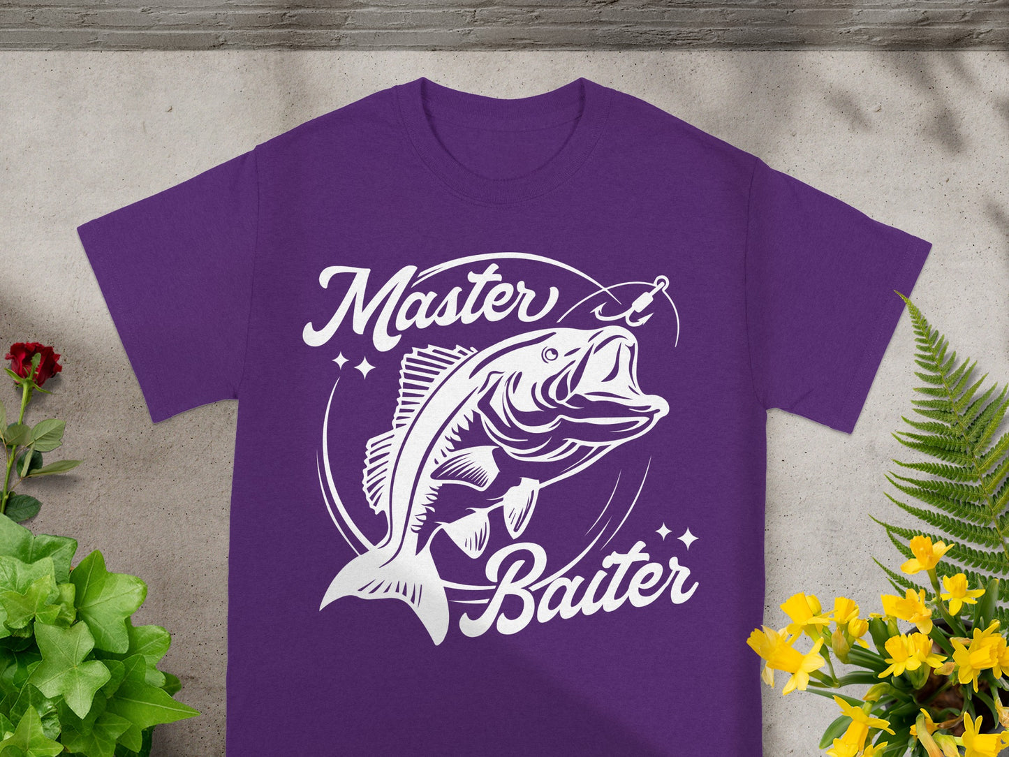 Purple t-shirt with white graphic of a fish jumping with fishing hook and text "Master Baiter".