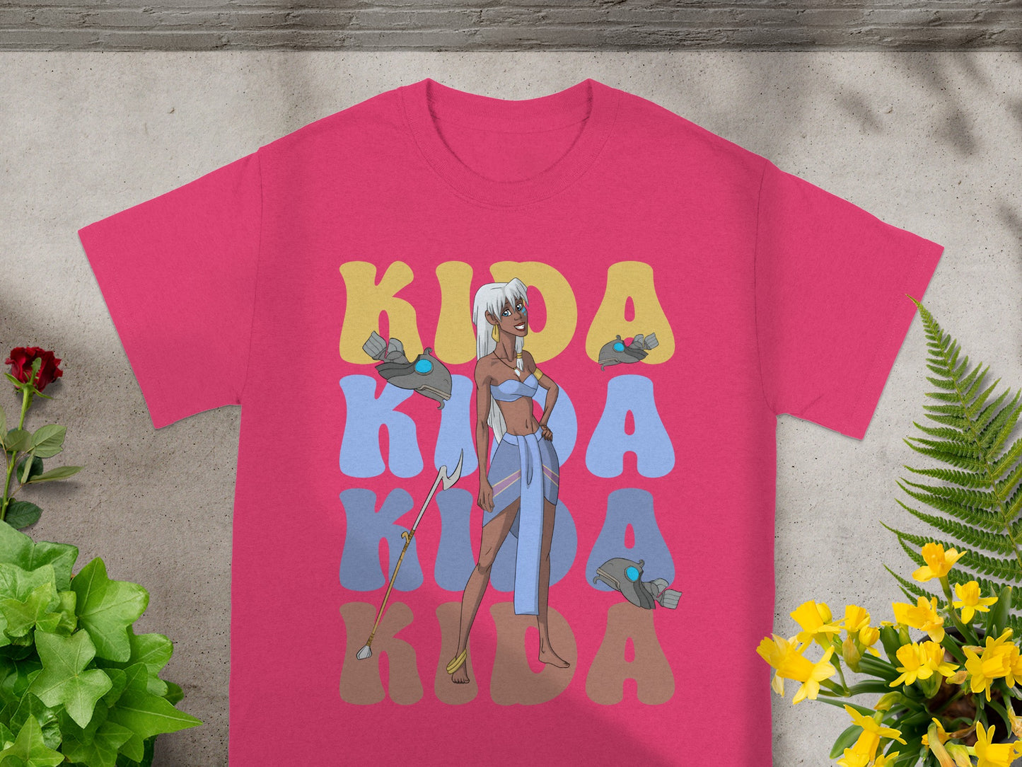 Kida Nedakh from Atlantis standing with a staff, "Kida" text.