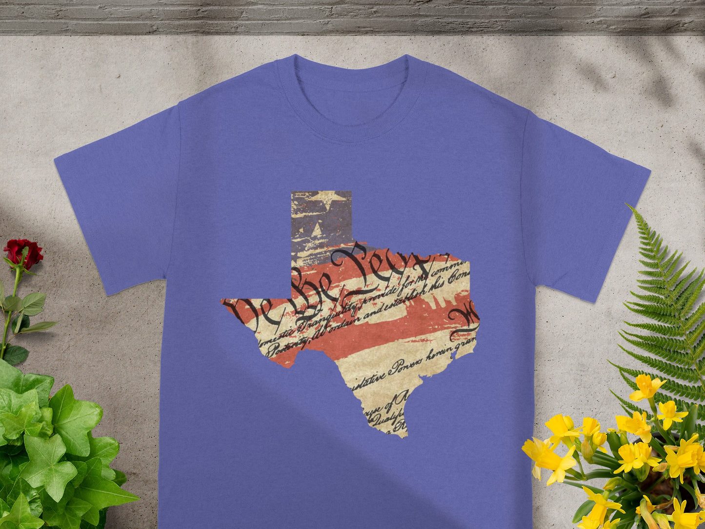 Purple t-shirt with Texas outline graphic featuring US Constitution text and flag imagery.