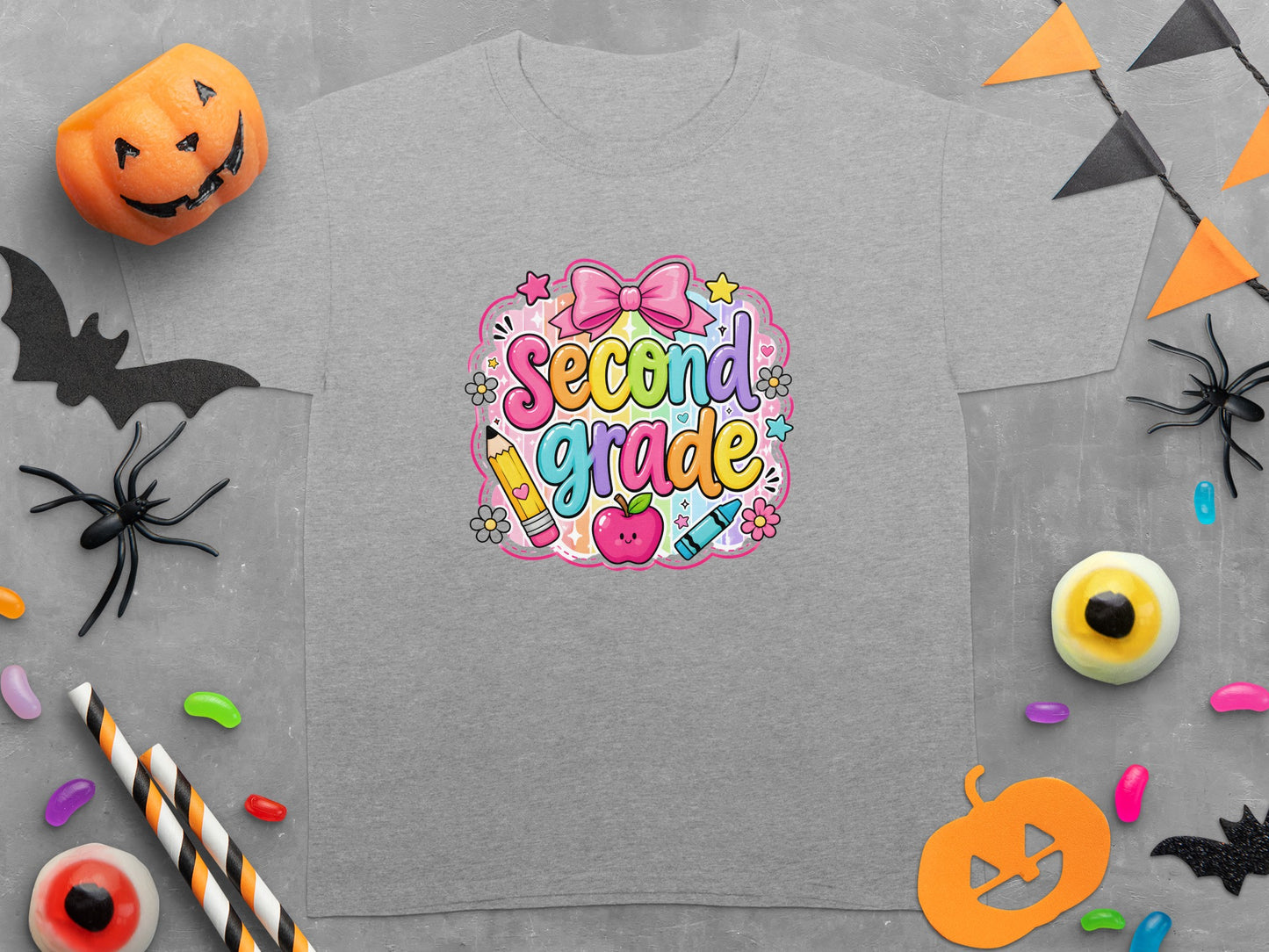 Grey t-shirt with "Second Grade" text design featuring a pink bow, apple, and pencil.
