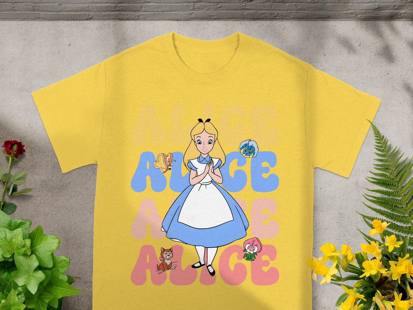 Yellow t-shirt with Alice in Wonderland characters and "ALICE" text.