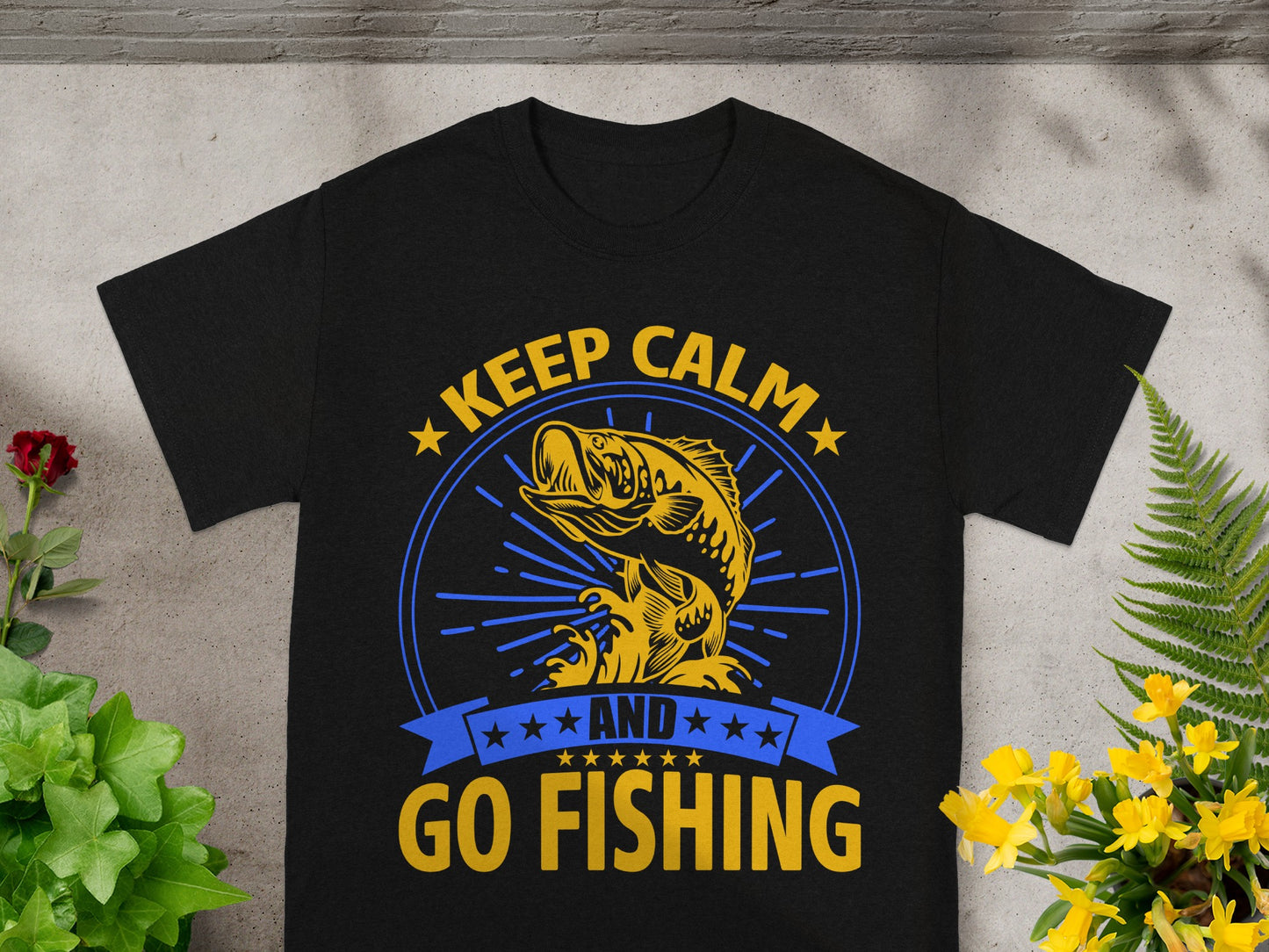Black t-shirt with yellow text "KEEP CALM AND GO FISHING" and a leaping bass graphic.