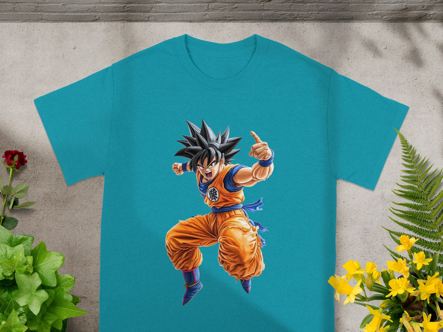 Turquoise t-shirt featuring Goku from Dragon Ball Z in an action pose.