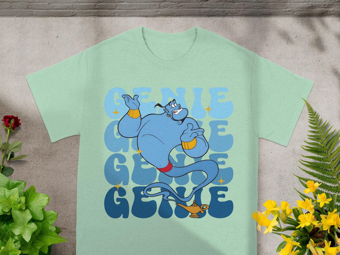 Blue genie with "Genie" text in background on a light blue t-shirt.