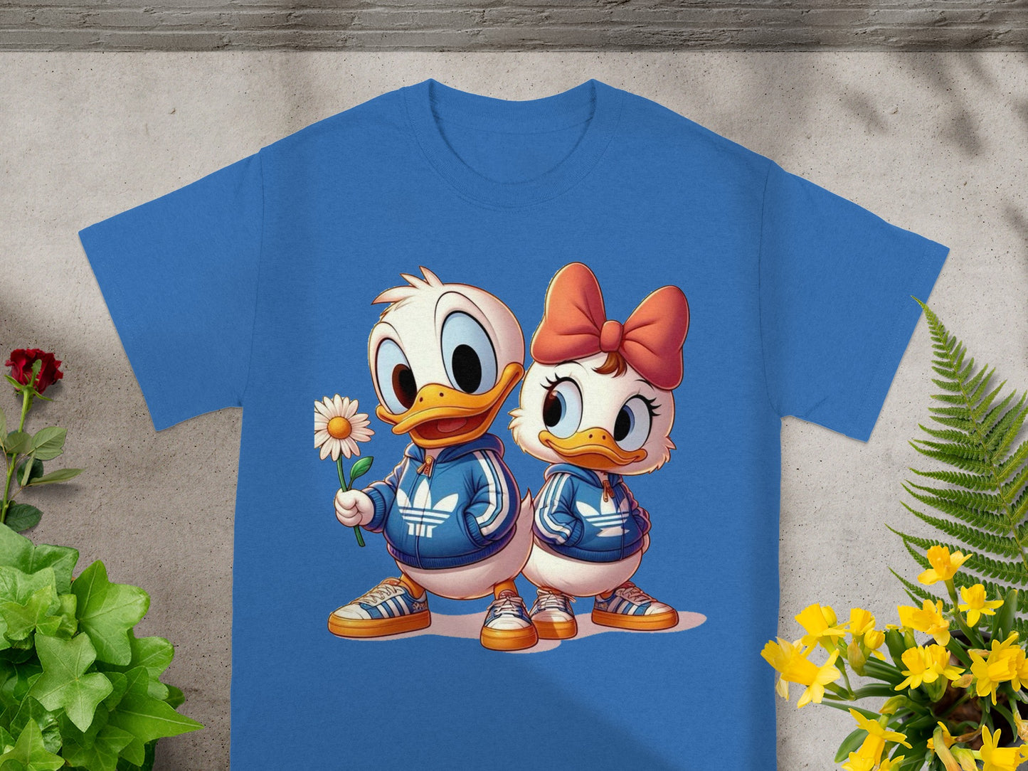 Cartoon ducks Daisy and Donald in blue tracksuits holding flower.