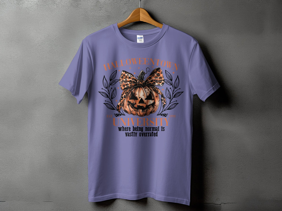 Purple t-shirt with "Halloweentown University" graphic featuring a pumpkin and leopard print bow.