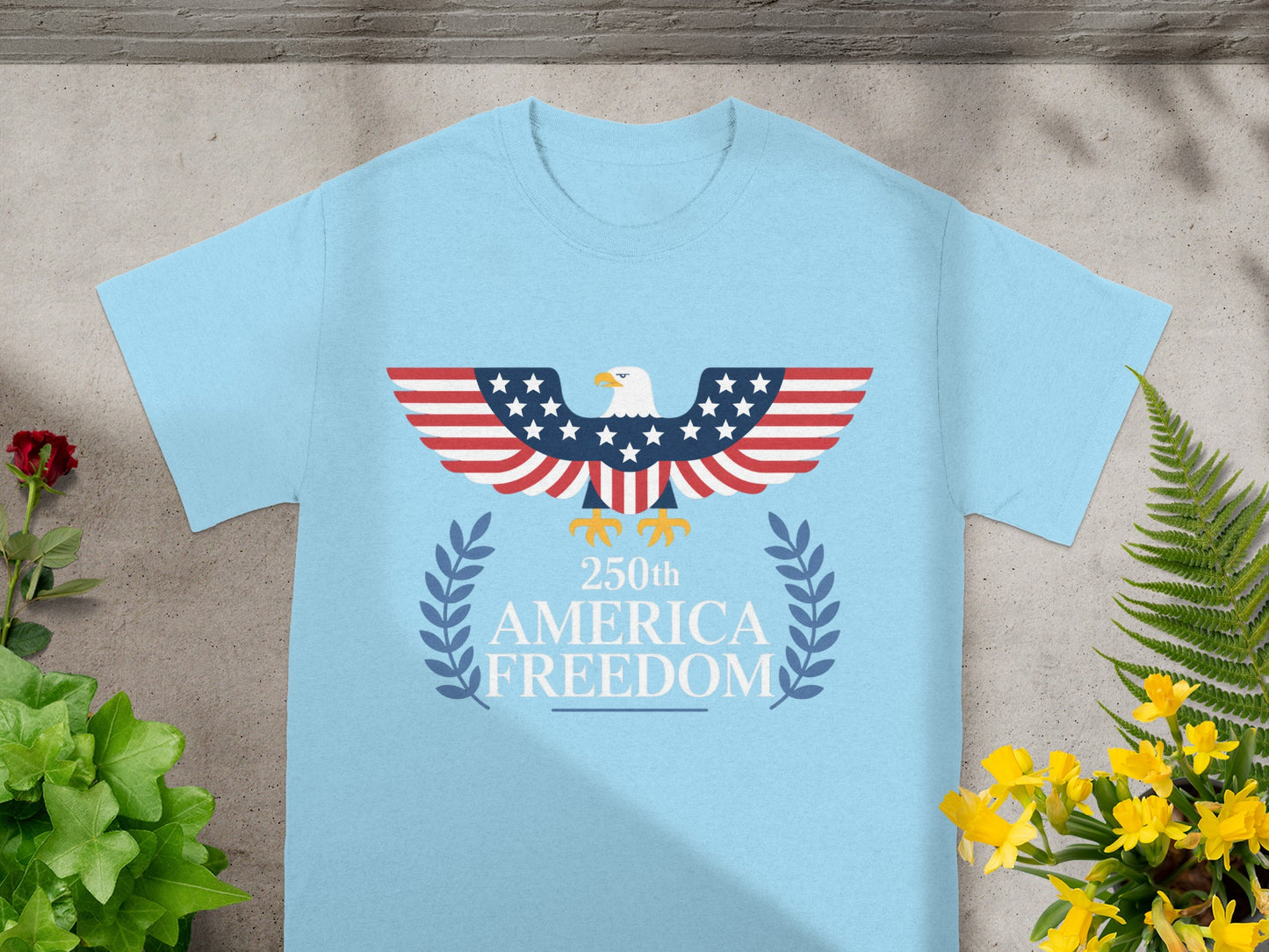 Light blue t-shirt with eagle, American flag wings, and "250th AMERICA FREEDOM" text.